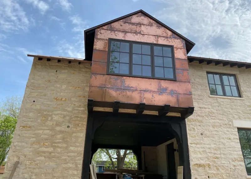 Copper metal panel facade on a stone building for Metal Roof Coating in Bradenton