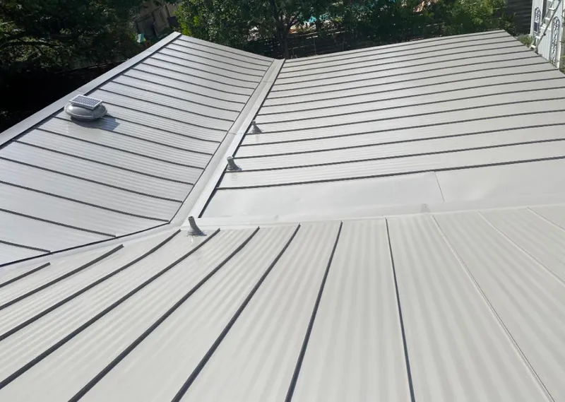 Solar attic fan installed on a metal roof for Roof Ventilation in Bradenton